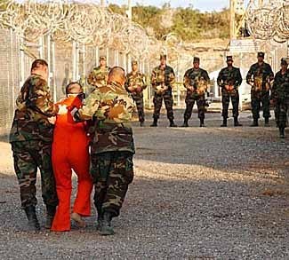 prisoner being led by US soldiers