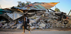 Quake damage in Haiti in 2010, cc Colin Crowley, modified, https://flickr.com/photos/newbeatphoto/4294442976/in/photolist-7xu9hh-7zX2kw-dog7GH-6Xnxb1-4G3AtZ-6XnB8q-4G3yVV-7zT6p8-dog7HR-7zT3MB-dog7TX-dogfZQ-pjkBpF-doggbu-2iNFtS6-dogfVs-2mX2bgy-6XnKeb-6XiTxF-6XiJDK-7xqkXT-6XiMZg-7J6aVY-6XnLS3-J3gKE7-ENCb8-cXWdXN-92w5uR-72u85z-6XiVj4-6XnEzd-E2N3kn-92zcy9-E2sp1S-Ex3uwq-6XiPXv-6XnQjj-ipJrpo-r5L6Jn-EZb81n-wPhCWa-Mn5KMD-2mjhjGq-87Bp1c-92wfUc-Z3mEcC-87BqGt-92wfZz-2mjcequ-TxhYVk