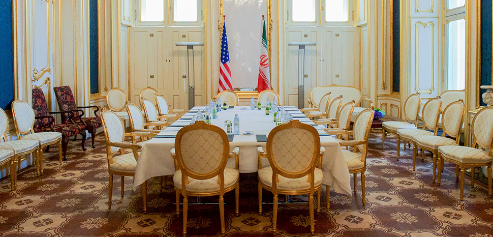 cc US Department of State, Wikicommons, A view of the Blue Salon at the Palais Coburg hotel in Vienna, Austria, the 19th-century, Neoclassical former palace for Prince Ferdinand of Saxe-Coburg, where most of the bilateral meetings between the United States, other P5+1 countries, European Union, and Iran took place, as well as one-on-one meetings between Secretary Kerry and Iranian Foreign Minister Javad Zarif. Secretary Kerry sat on the left side of the table, third chair from the bottom, and Minister Zarif sat directly across on the right side of the table. [State Department photo/ Public Domain]