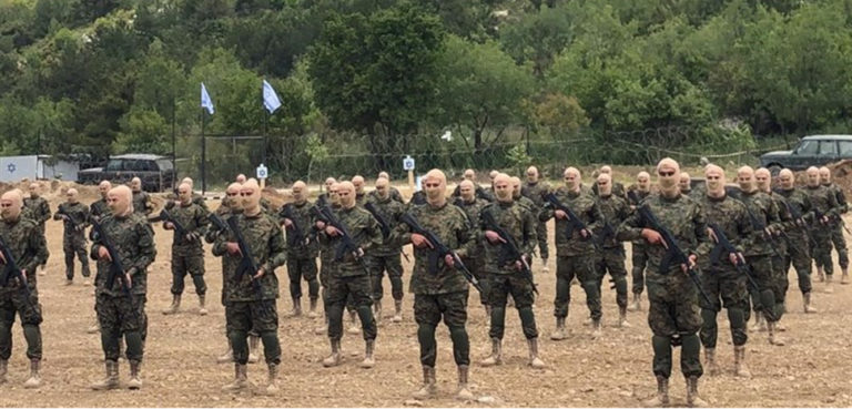 Fighters from the Lebanese militant group Hezbollah carried out a training exercise in Aaramta village in the Jezzine District, southern Lebanon, on Sunday, May 21, 2023. The show of force came ahead of “Liberation Day,” the annual celebration of the withdrawal of Israeli forces from south Lebanon on May 25, 2000, and in the wake of a recent escalation of the Israel-Palestine conflict in the Gaza Strip. Tansim news, modified, https://he.m.wikipedia.org/wiki/%D7%A7%D7%95%D7%91%D7%A5:2023_Hezbollah_drill_in_Aaramta_01.jpg