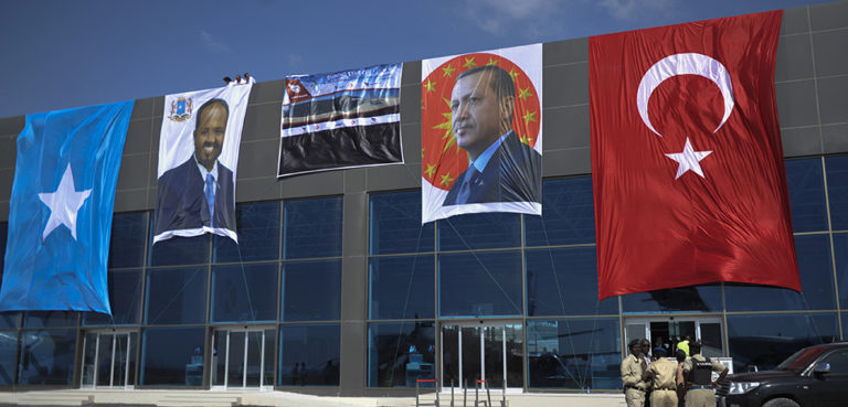 The new terminal of Aden Abdulle International Airport built by Turksih company in Mogadishu, Somalia on January 25. 2015 AMISOM Photo / Ilyas Ahmed; AMISOM public information, modified, https://commons.wikimedia.org/w/index.php?sort=last_edit_desc&search=erdogan+somalia+filetype%3Abitmap&title=Special:Search&profile=advanced&fulltext=1&advancedSearch-current=%7B%22fields%22%3A%7B%22filetype%22%3A%22bitmap%22%7D%7D&ns0=1&ns6=1&ns12=1&ns14=1&ns100=1&ns106=1#/media/File:2015_01_25_Turkish_President_Visit_to_Somalia-3_(16176886347).jpg