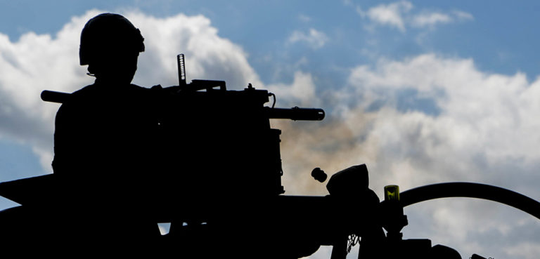 A British soldier fires a 40mm grenade machine gun at the Bemowo Piskie Training Area, Bemowo Piskie, in Poland, on June 8, 2017. Saber Strike 17 is a U.S. Army Europe-led multinational combined forces exercise conducted annually to enhance the NATO alliance throughout the Baltic region and Poland. This year's exercise includes integrated and synchronized deterrence oriented training designed to improve interoperability and readiness of the 20 participating nations' militaries. (U.S. Army photo by Spc. Samuel Brooks) cc U.S. Army Europe, modified, https://flickr.com/photos/usarmyeurope_images/35241668646/in/photolist-Zpe5HU-J3GH84-2n6feqc-2nPY1C4-2n7k8af-2qAt3jS-2n68nrD-vDMSd-2n7xsc4-VGbLhE-VKJnvp-VGaiz3-2n7gcL4-2n6czro-2n6hSy5-2n6izSx-2n7kNnx-2n7whU9-2n9V2jz-2n8Avts-2n8mUAF-2nbHm8r-4UKFAf-2n6pTTk-2n6e34s-2n8vRXF-2n6gtXg-2oBuokP-qTo84j-2n7jHM4-qTo81J-GYf1WY-2n6cBax-ca2vyu-2n6ghfE-2n6ceNj-QFbRMR-2ncwNZU-2n7wCMV-2n7vNPU-2neeoxq-2nWkguh-2n7FHU9-bbmcSe-2n7FH9w-2n84rn8-2n7x4hk-2n7j5ei-2n8yEai